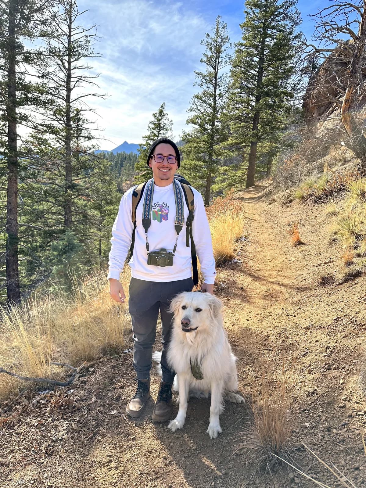Travis and Apollo hiking in Colorado
